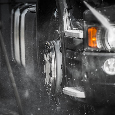 Professional mobile truck cleaning team at work
